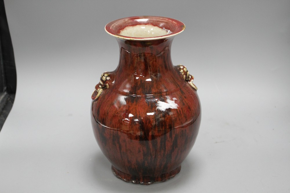 A Chinese flambe vase, with lion mask ring handles to the shoulder, H. 28.5cm